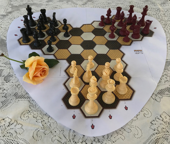 Photo of Hexes 4-pawn chess for three players.